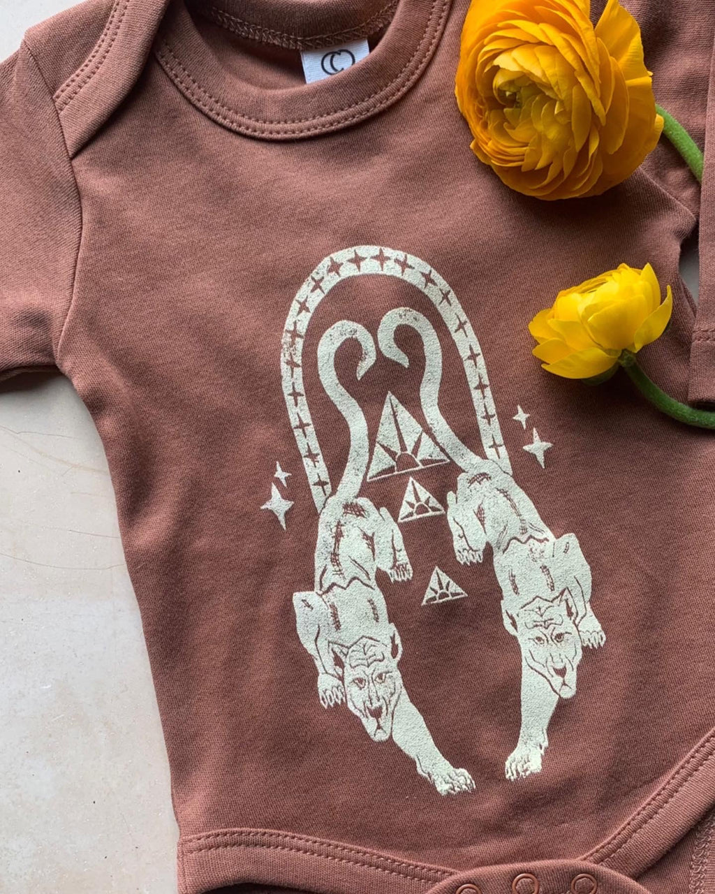 Panther Rising Baby Onesie in Clay